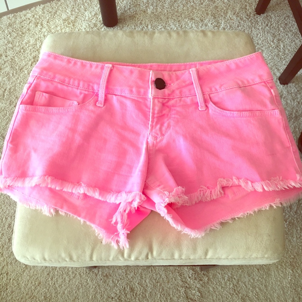 COPY - Pink cut off shorts.